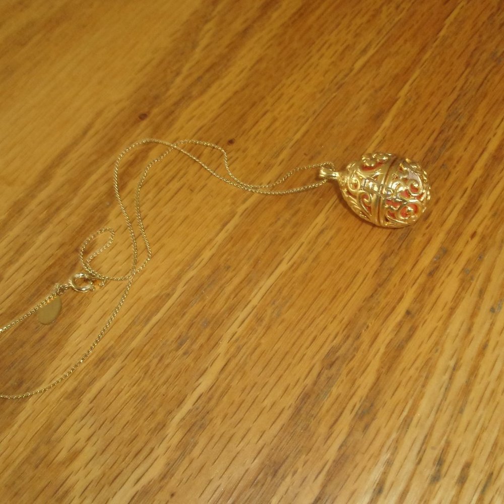 AFJ necklace gold tone egg shape locket